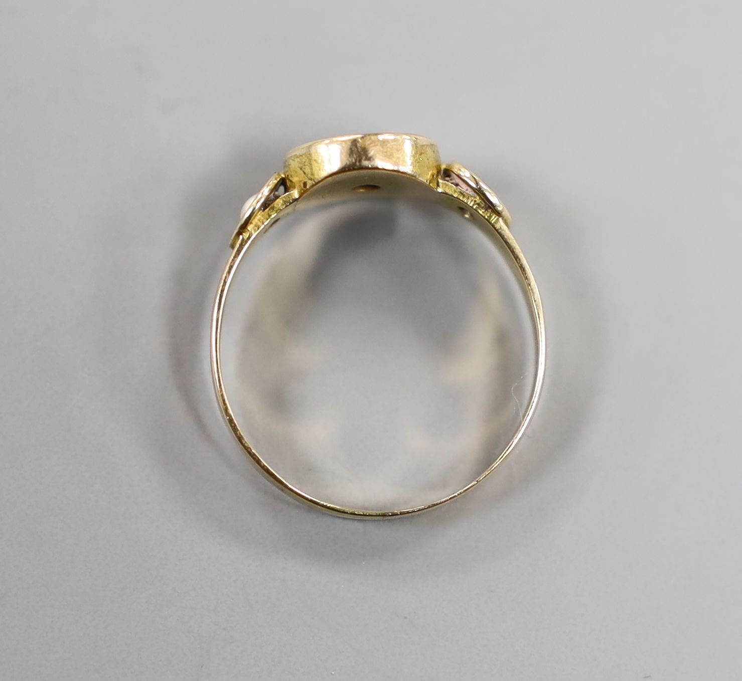 A Victorian yellow metal black enamel, seed pearl and diamond set mourning ring, size O/P, gross weight 2.3 grams.